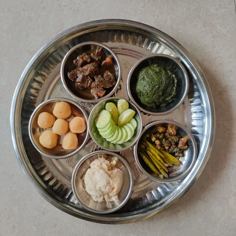 A traditional Banarasi thali with small bowls