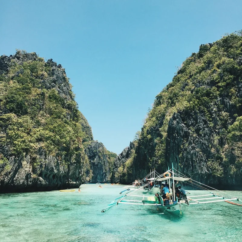 A longtail boat by a tropical island in Thailand