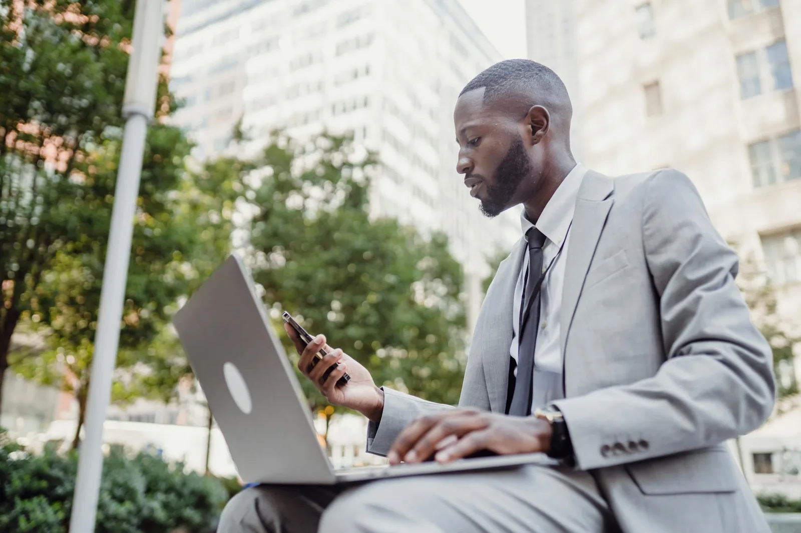 A business professional reviewing their website on a laptop