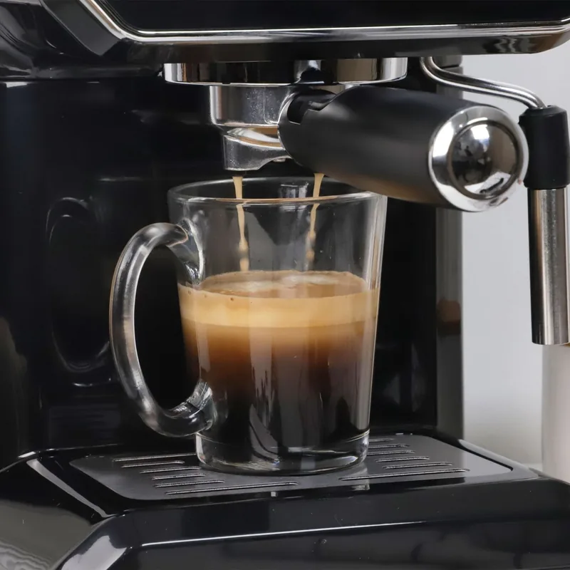 Kitchen electrical appliance pouring coffee