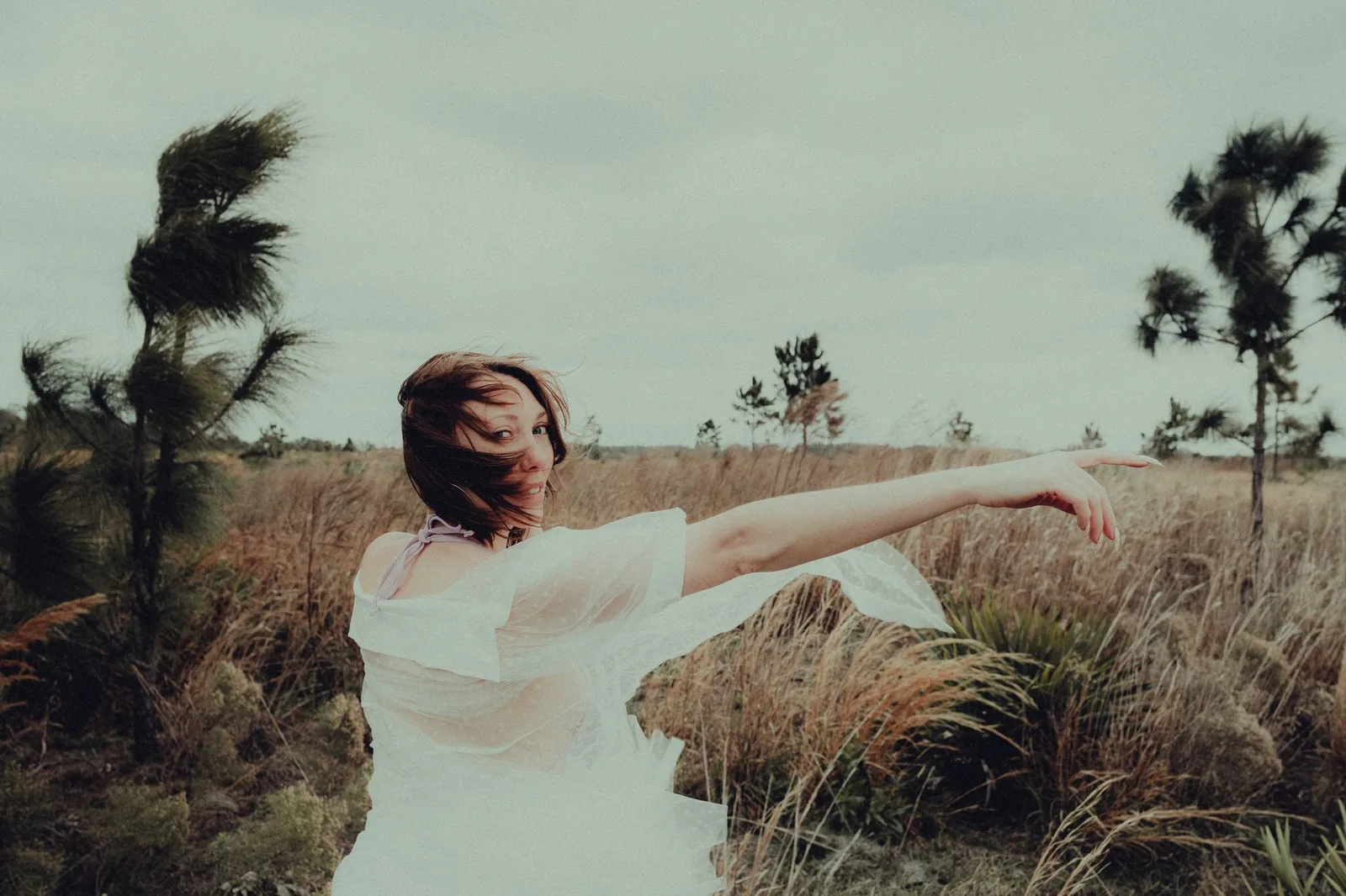 Model wearing a relaxed everyday dress in warm natural light