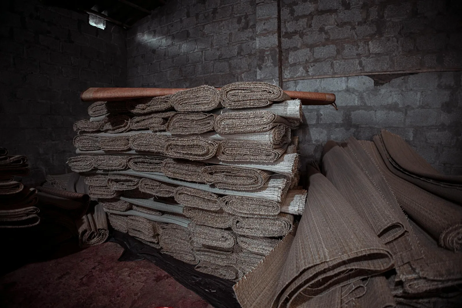 Rolls of rugs stacked, ready for sourcing