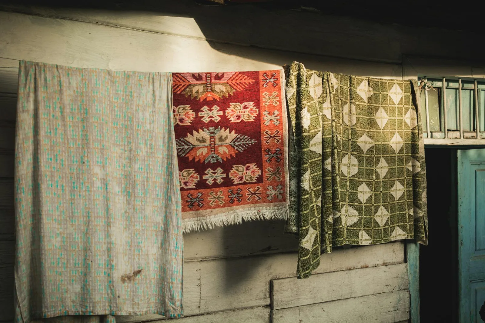Handwoven patterned rugs in warm natural light